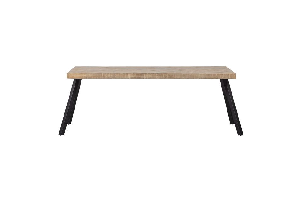 El tablero de la mesa presenta un elegante y exclusivo diseño en espiga con un borde curvado en